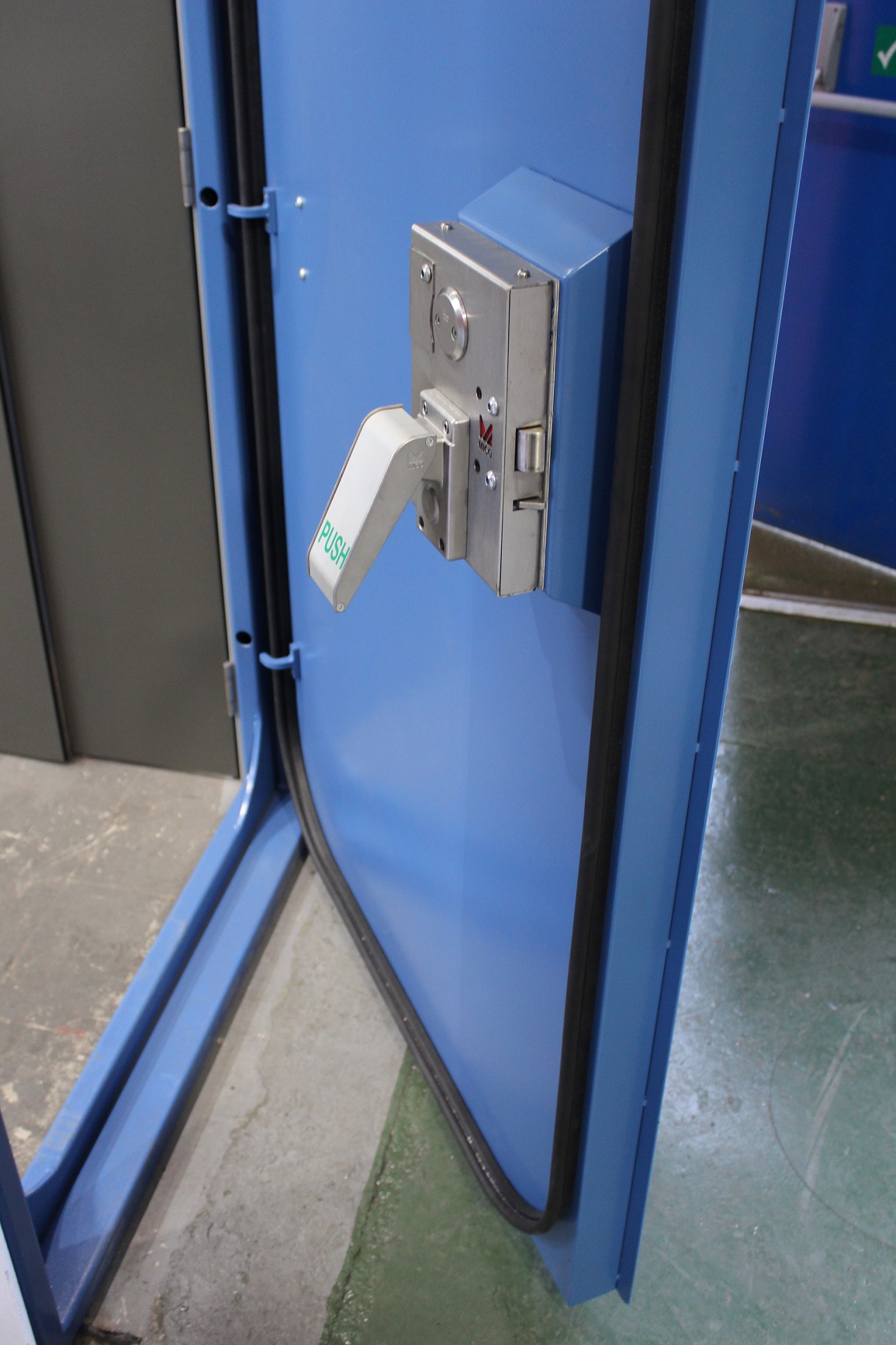 Flood door internal hardware